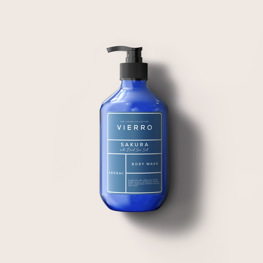 A cobalt blue pump bottle of VIERRO Matcha body wash with a black pump dispenser, set against a solid light beige background with a soft shadow.