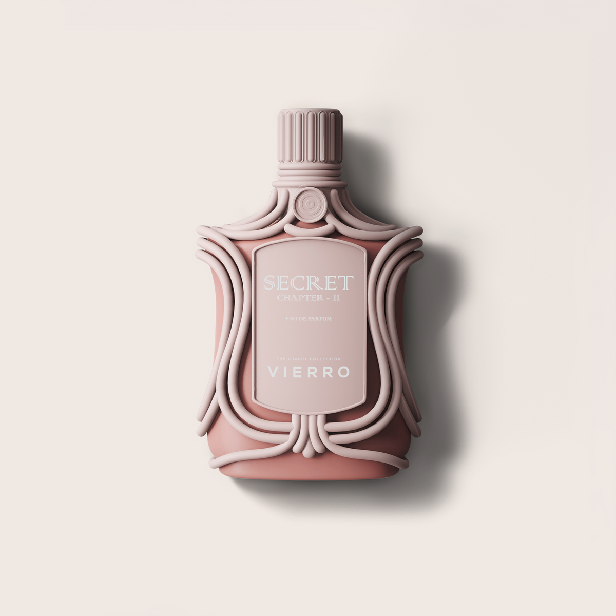 A sculptural perfume bottle in a dusty rose pink color with ornate details, featuring a ribbed cap and a central label that reads 'SECRET CHAPTER II' and 'VIERRO'. The bottle is centered against a warm off-white background with a soft shadow to the right.